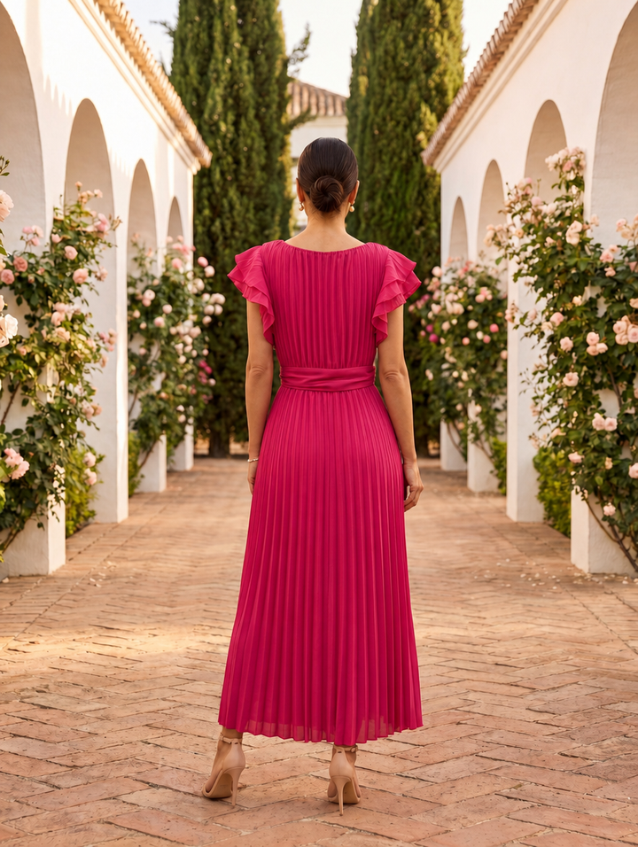 Feminine pleated maxi dress with ruffle sleeves, ideal for wedding guests, parties, or summer events.