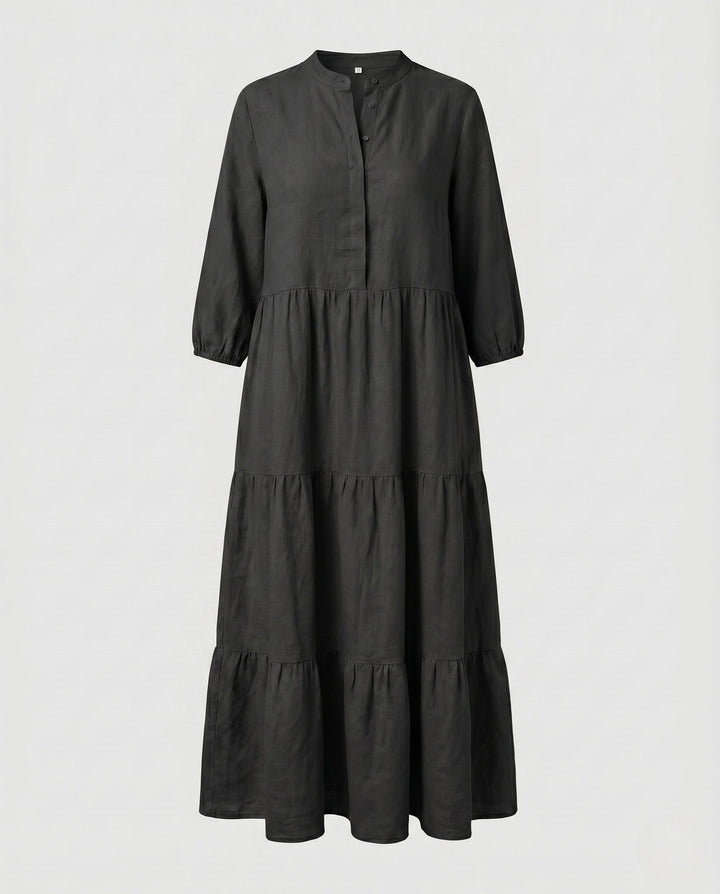 Stylish women's tiered midi dress, suitable for various occasions, with a distinctive button placket.