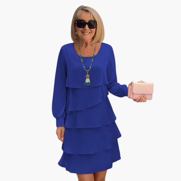 Elegant women's tiered ruffle party dress with long sleeves & scoop neck. Perfect flowy, comfortable knee-length evening dress.
