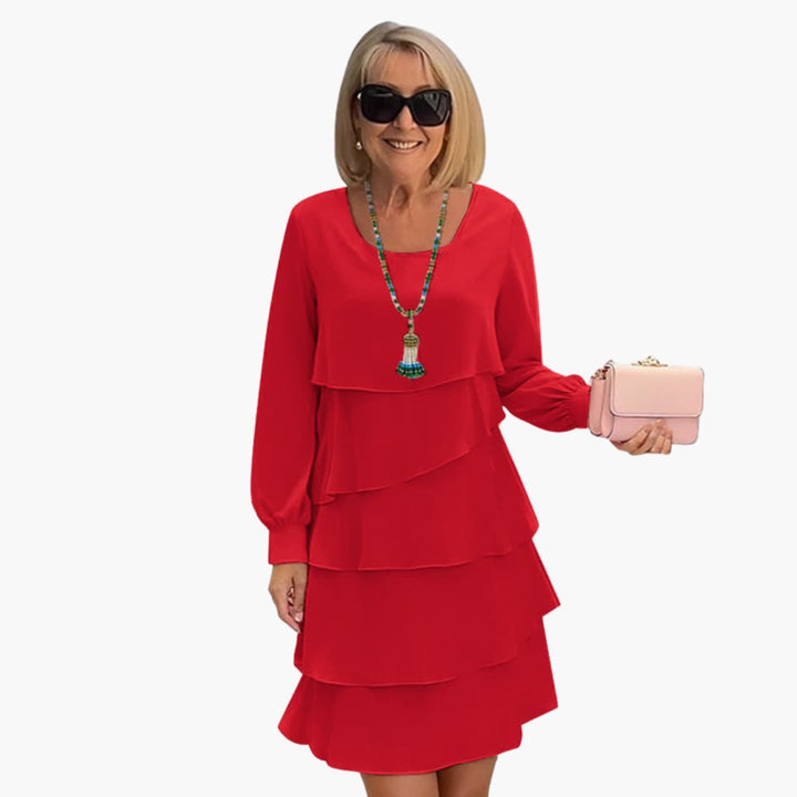 Effortless women's long sleeve tiered ruffle dress. Comfortable, flowy knee-length party dress for celebrations.