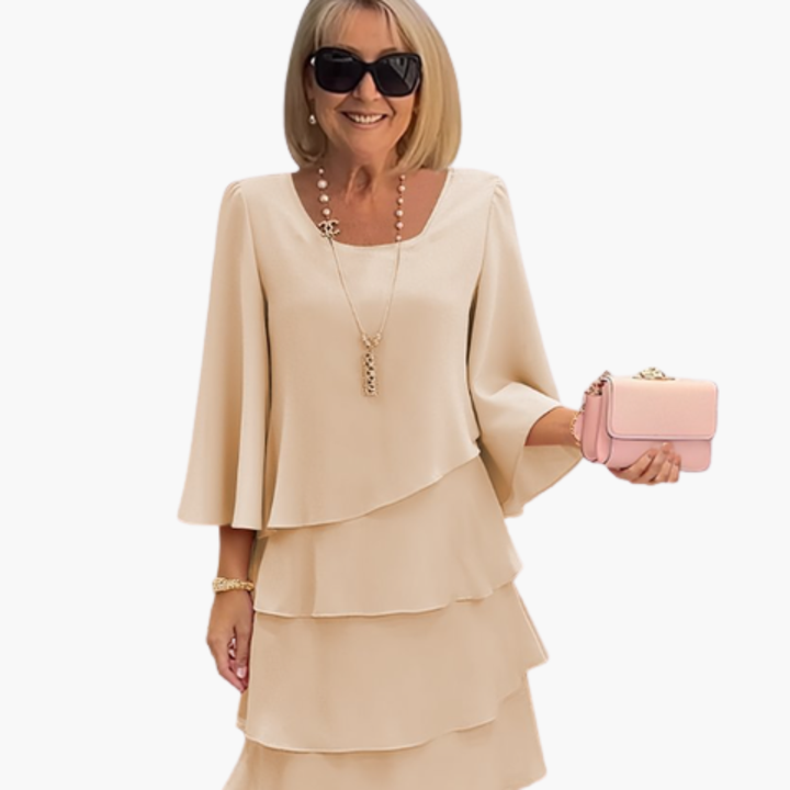Versatile women's long sleeve tiered ruffle dress. An elegant, comfortable knee-length party, evening, or casual dress.
