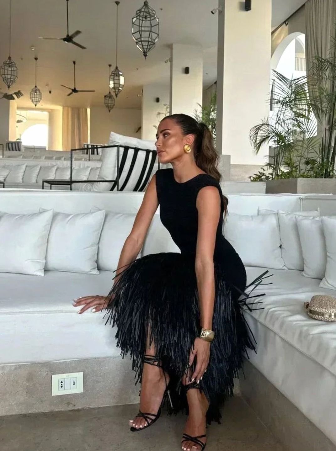 Elegant women's black sleeveless fringe hem midi cocktail dress, ideal for evening wear & events.