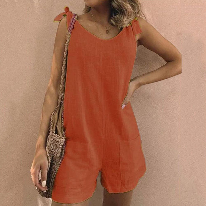 Comfortable women's sleeveless romper with chic bow straps & pockets, versatile summer fashion.
