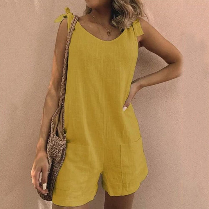 Stylish women's sleeveless romper featuring charming bow straps, ideal for warm weather and everyday comfort.