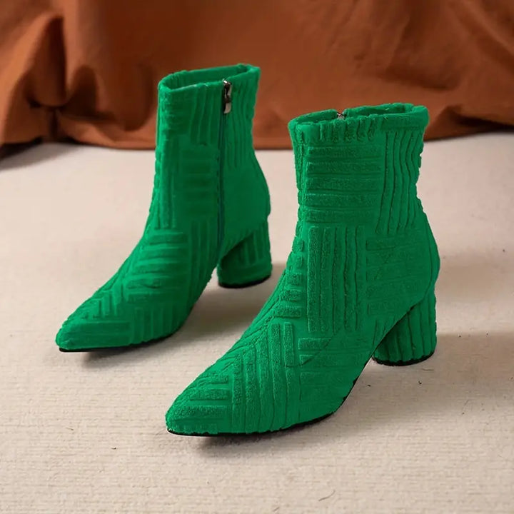 Fashionable Selene women's black block heel boots. Pointed toe, sturdy block heel, and practical side zipper for comfort.