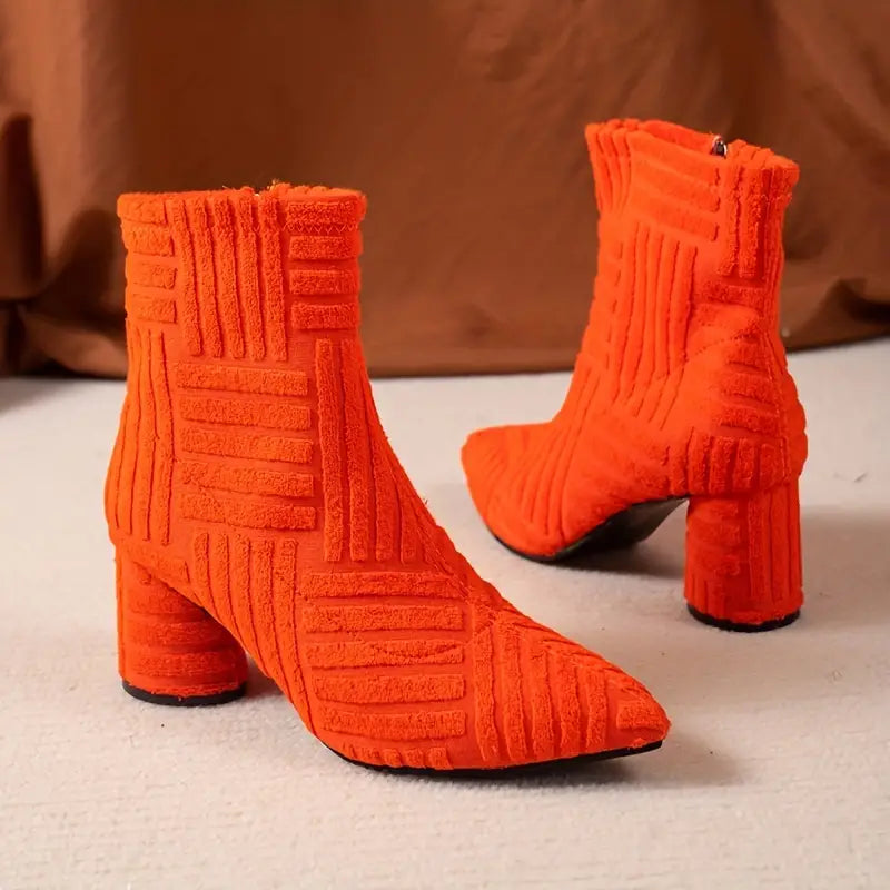 Elegant solid color women's Selene boots with a block heel. Features a pointed toe, comfortable platform, and side zipper.