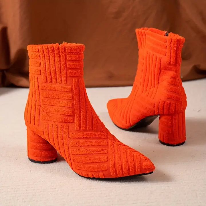 Elegant solid color women's Selene boots with a block heel. Features a pointed toe, comfortable platform, and side zipper.