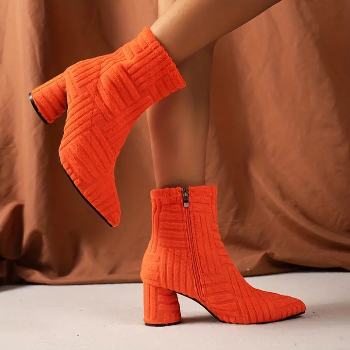 Selene solid color block heel boots for women. Elegant footwear with pointed toe, sturdy block heel, and side zip.