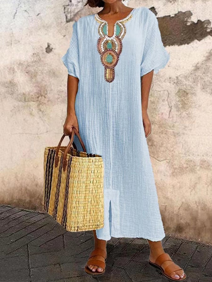 Flowy women's summer maxi dress with beautiful boho embroidery, offering a comfortable and stylish casual look.
