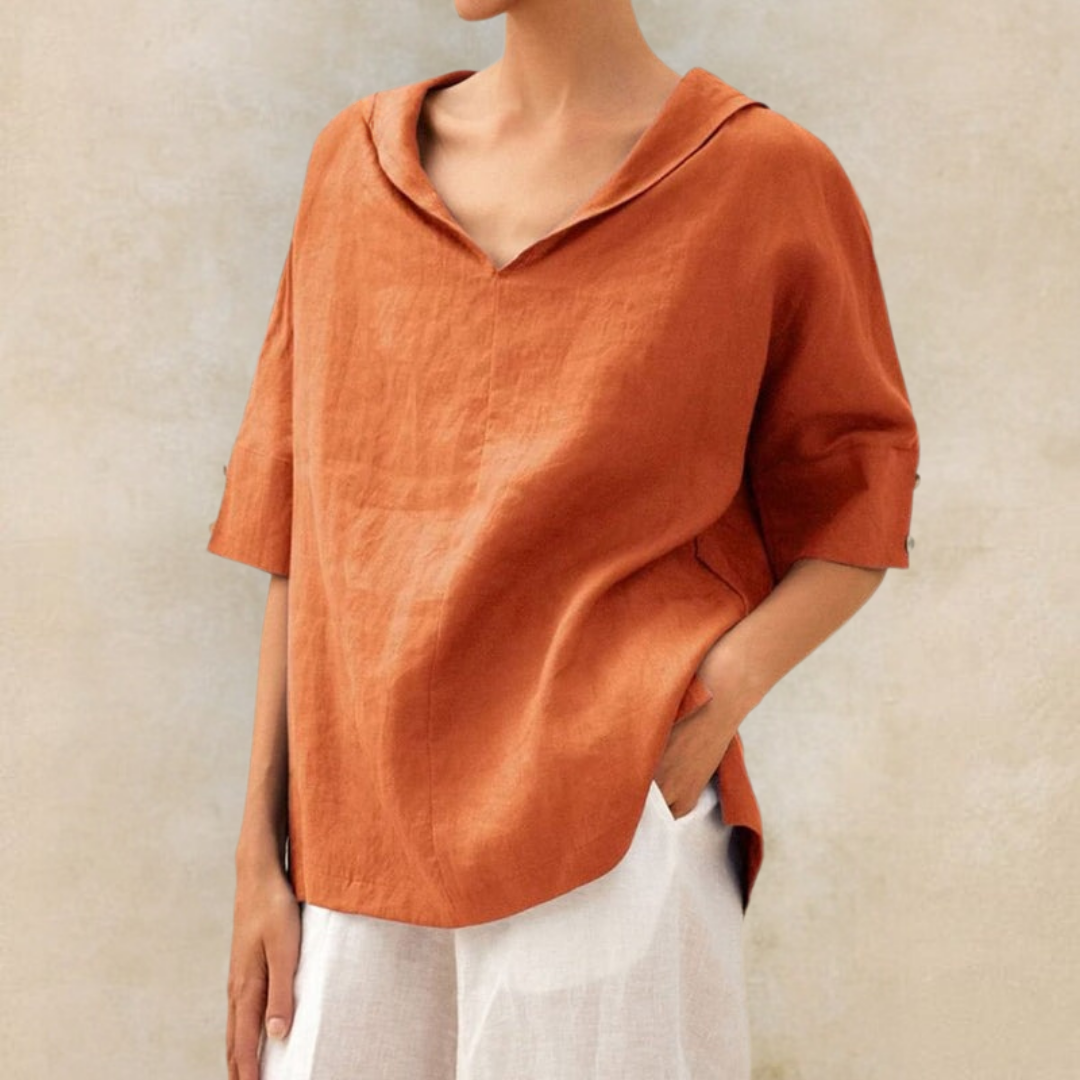 Elegant women's V-neck top in a relaxed fit, ideal for office wear or a chic casual spring/summer look.
