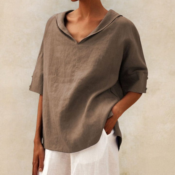 Sophisticated women's V-neck top, relaxed fit for casual or office wear. Loose, half sleeve, everyday chic fashion.