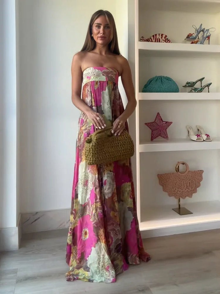 Flowing women's floral strapless maxi dress, an elegant choice for cocktail events & celebrations.