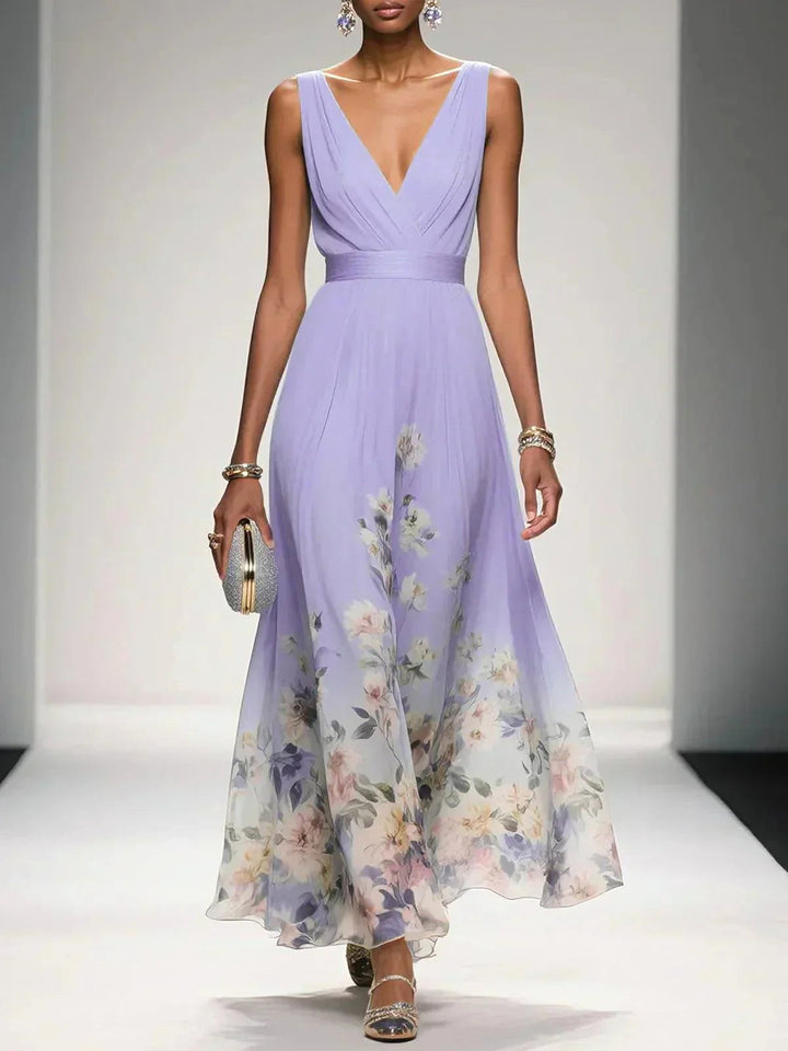 Close-up of the vibrant floral pattern on an elegant women's V-neck A-line midi dress. High quality.