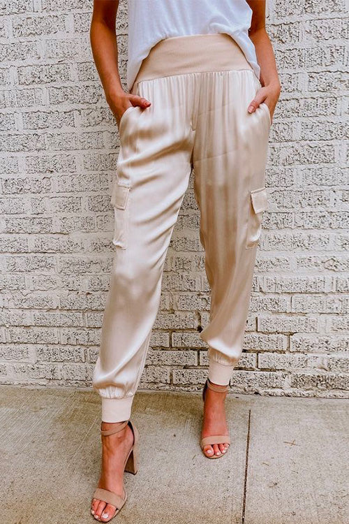 Women's high waist cargo jogger pants with utility pockets. Comfortable, tapered leg, relaxed fit for everyday style.