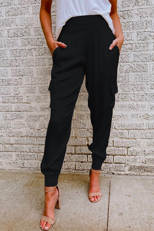Olive green women's high waist cargo jogger pants. Tapered leg with functional utility pockets for everyday wear.