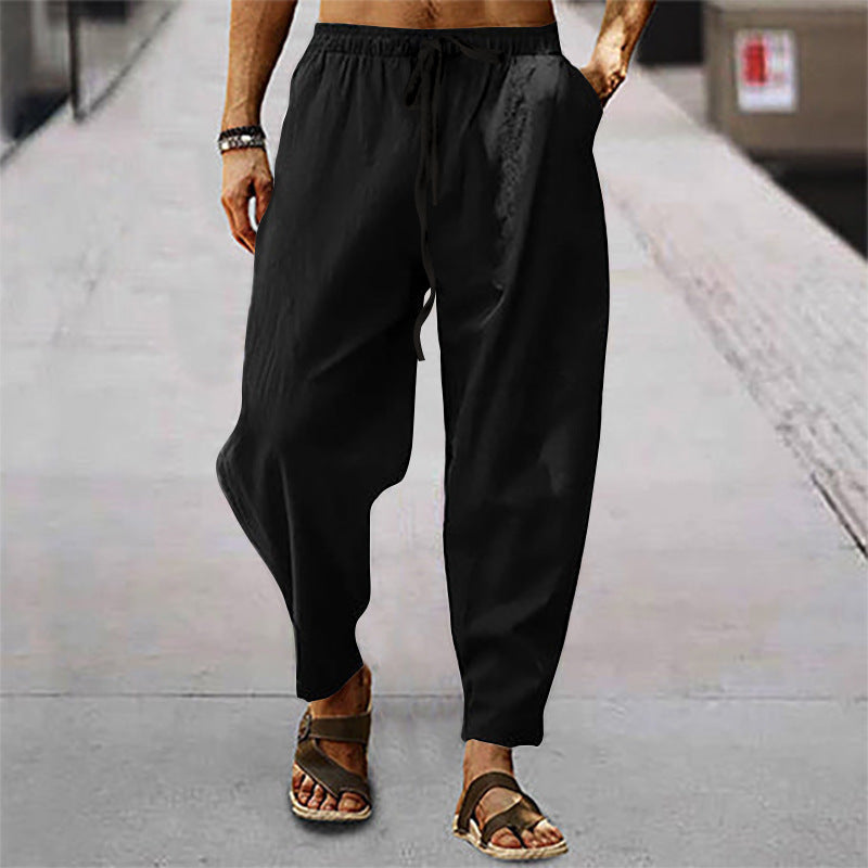 Side view of men's comfortable activewear pants, featuring a relaxed fit, tapered leg, and drawstring waist.