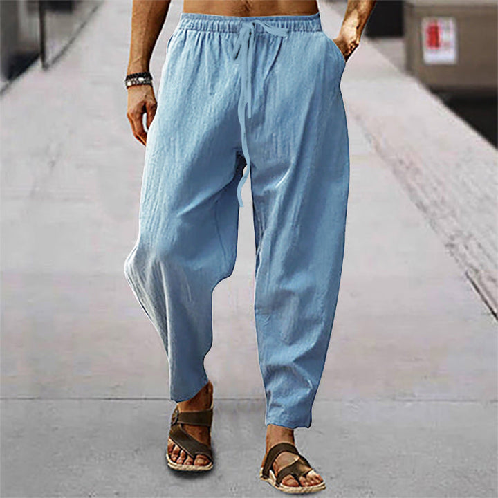 Comfortable men's casual pants with adjustable drawstring waist & relaxed fit, ideal for everyday wear.