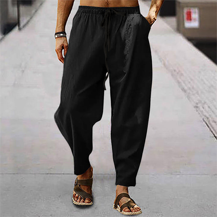 Versatile men's everyday pants with a comfortable relaxed fit and adjustable drawstring for casual looks.