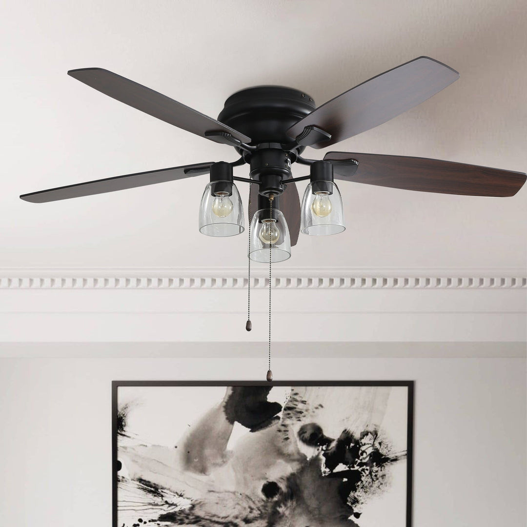 Modern 52 inch flush mount ceiling fan with LED light. Space-saving low profile design, perfect for any room.