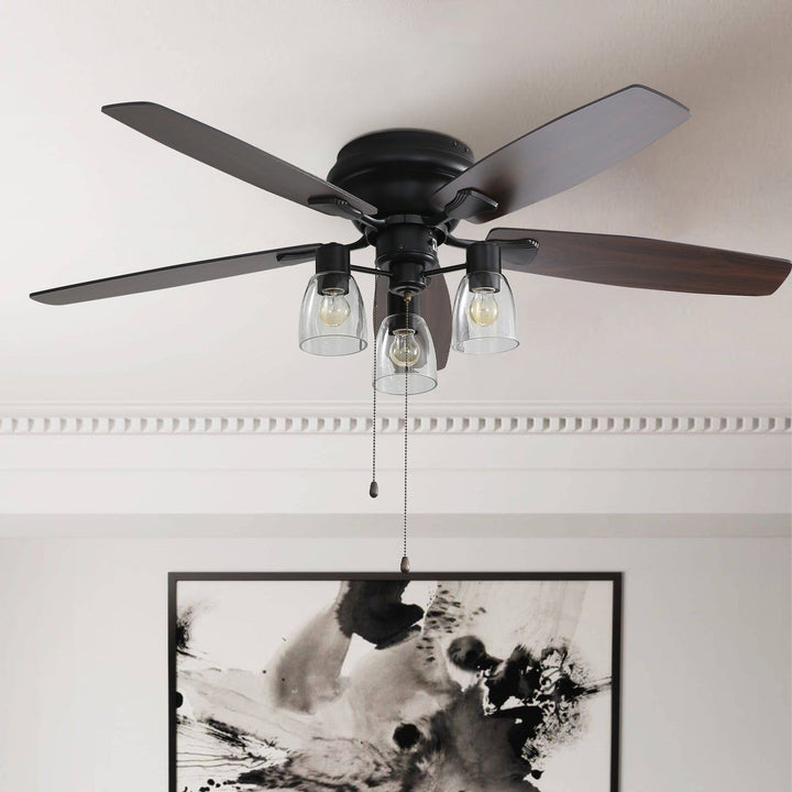 Modern 52 inch flush mount ceiling fan with LED light. Space-saving low profile design, perfect for any room.