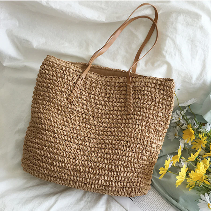 Elegant brown women's shoulder bag, woven design & ample space for daily essentials.