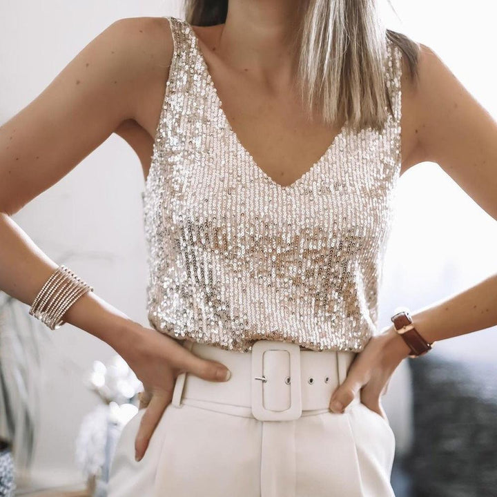 Women's glitter sequin spaghetti strap party top. Glamorous sleeveless design for festive evening wear.