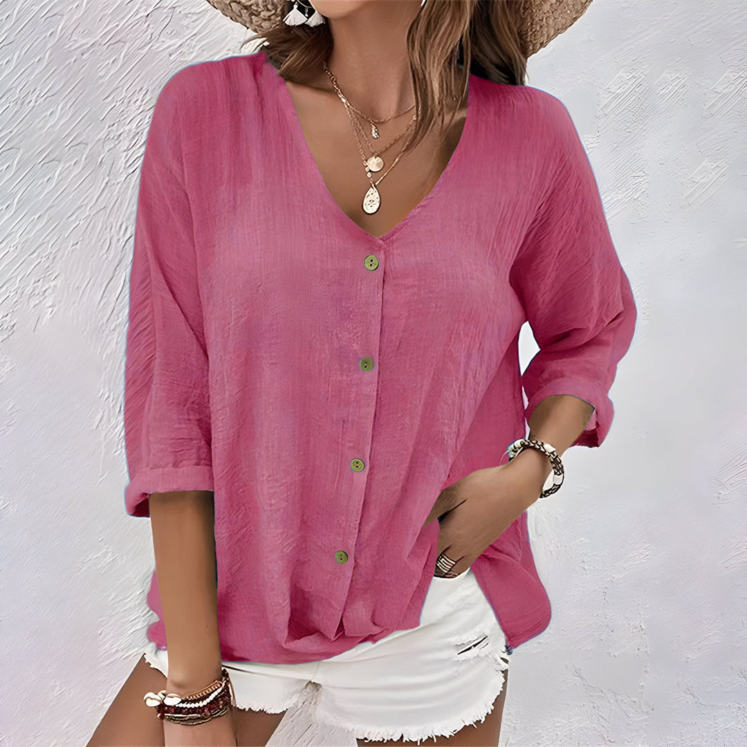 Elegant womens long sleeve V-neck blouse with button-up front & stylish roll-up cuffs. Relaxed fit.