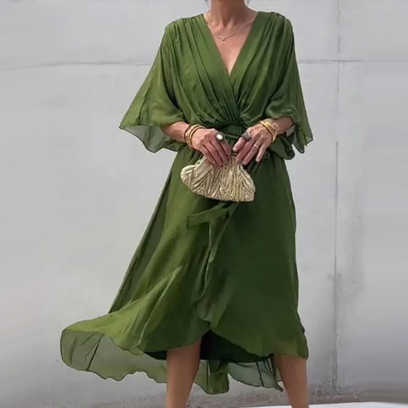 Comfortable plus size flowy midi dress for women, featuring a flattering V-neck and half sleeves.