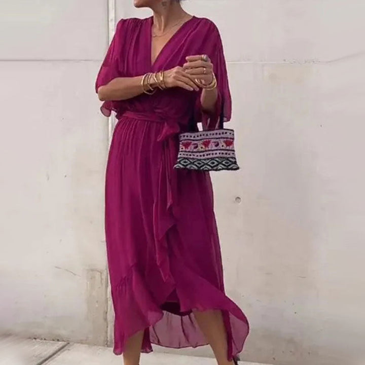 Curvy women's plus size flowy midi dress with a stylish V-neck and comfortable half sleeves.