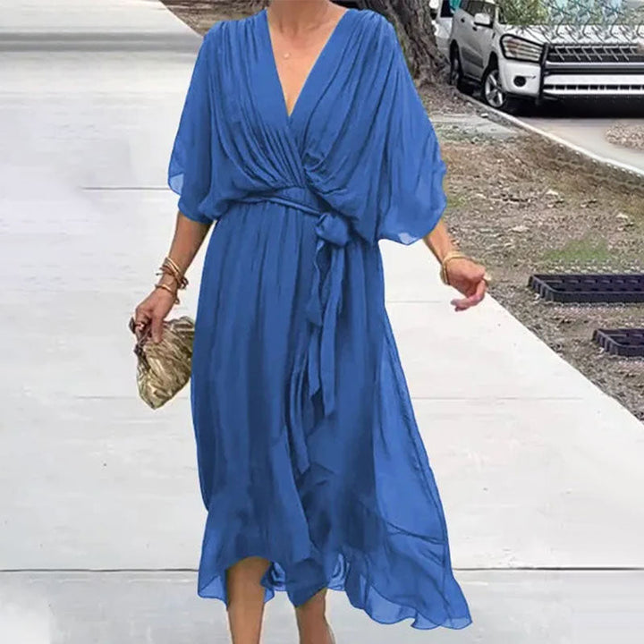 Chic plus size flowy midi dress with V-neck, an elegant choice for women's summer events.