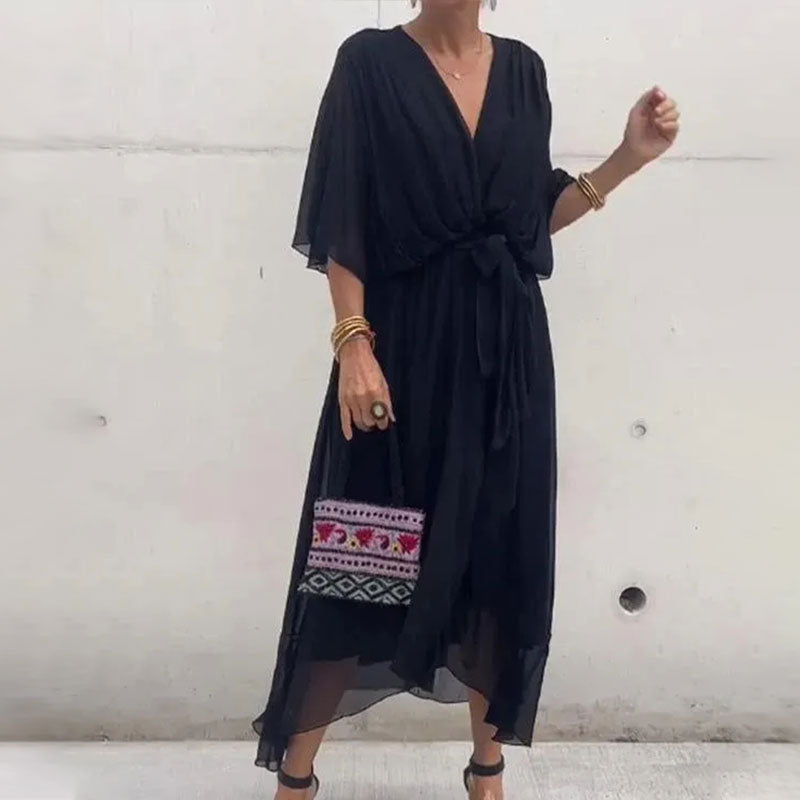 Beautiful plus size women's flowy midi dress with V-neck, offering comfortable and stylish curvy fashion.