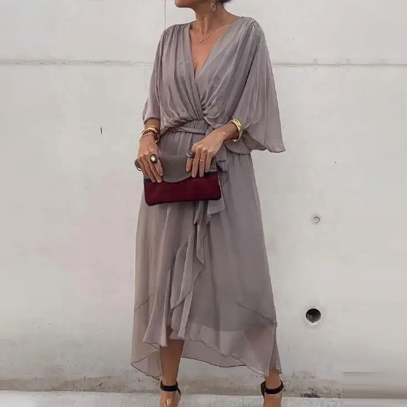 Flattering V-neck plus size flowy midi dress for women, offering a comfortable and elegant fit.