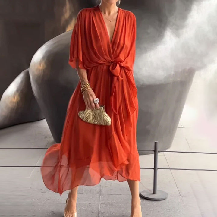 Women's plus size elegant flowy midi dress with V-neck, perfect as a versatile party or occasion dress.