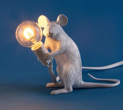 Charming SqueakLight mouse LED table lamp, a resin-crafted desk light for whimsical decor and unique ambiance.