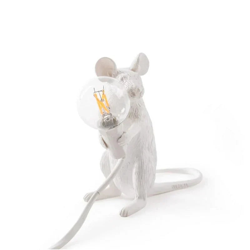 Whimsical resin mouse LED lamp. This decorative animal table lamp adds playful charm and unique light to any room.