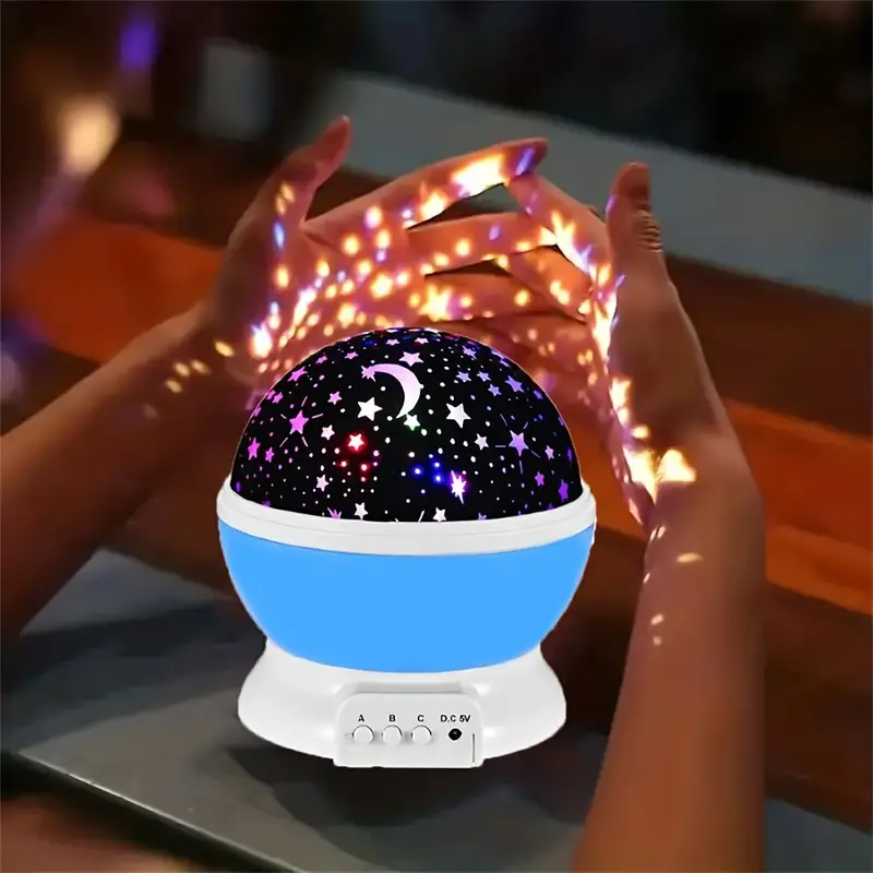 Celestial star & moon projector night light with music player, ideal for home decor.
