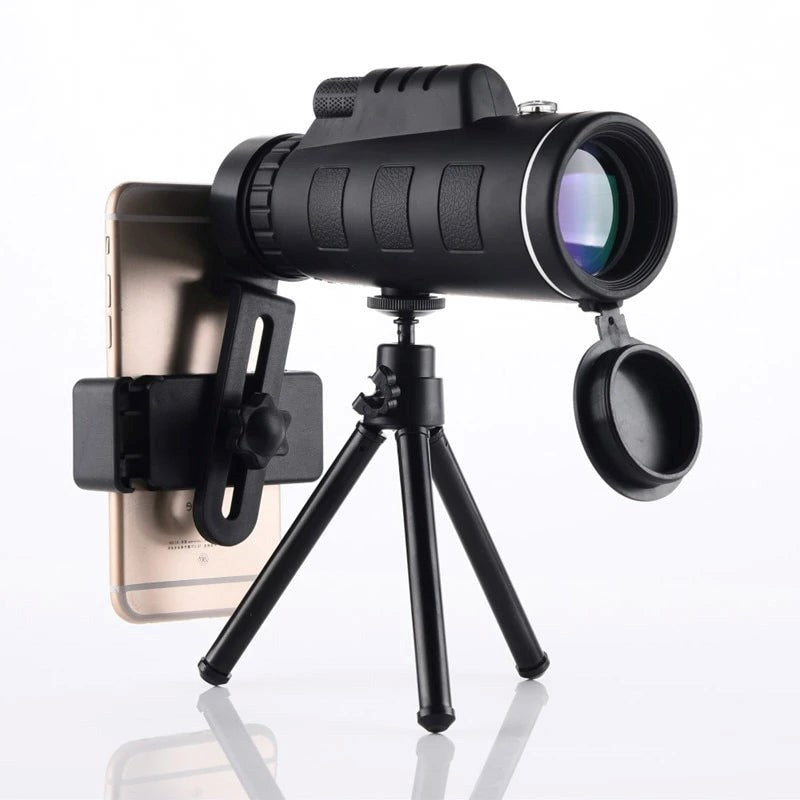 High-powered waterproof monocular telescope with tripod & phone clip for smartphone photography.