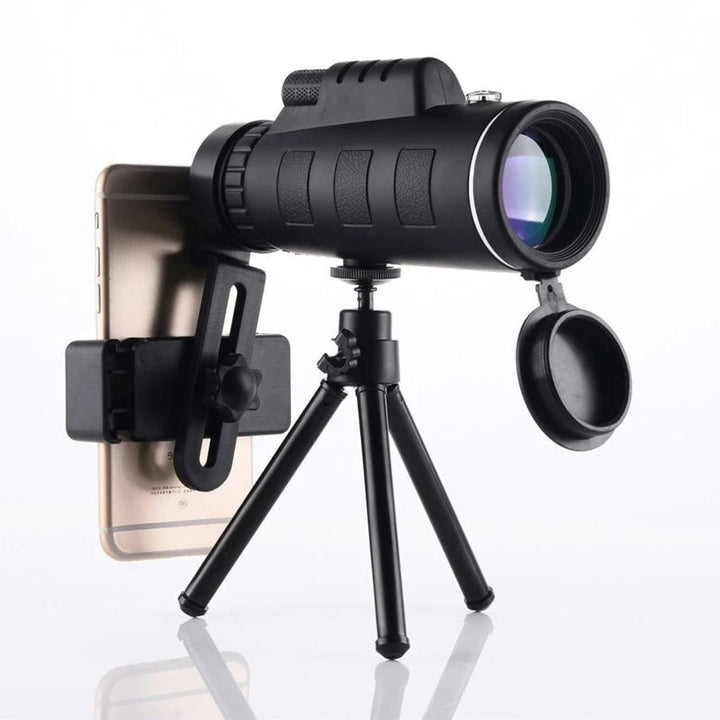 High-powered waterproof monocular telescope with tripod & phone clip for smartphone photography.