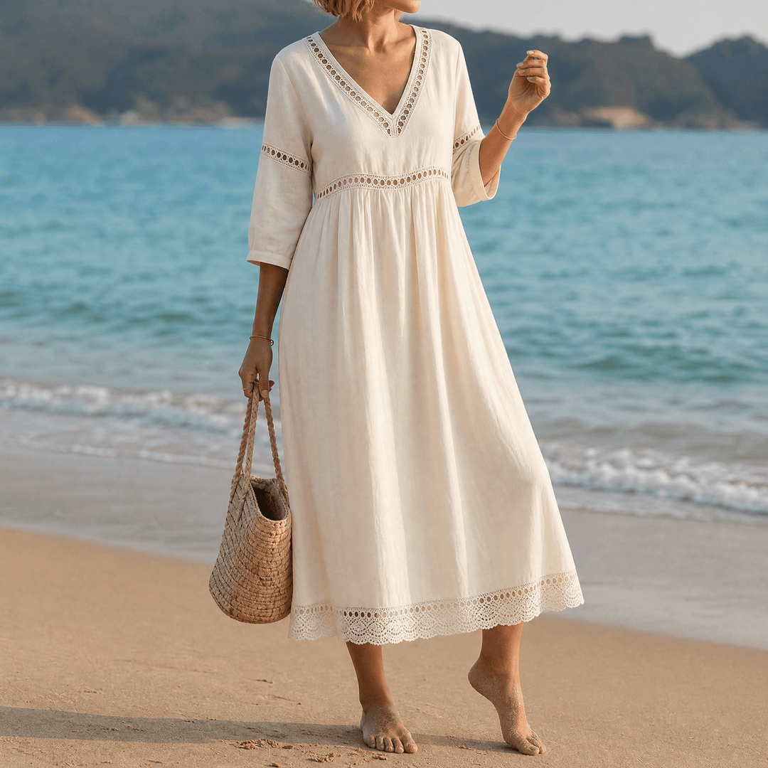 Texture detail: Soft fabric of a women's summer midi dress with elegant crochet trim and V-neck.