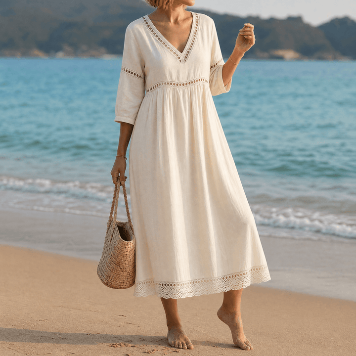 Texture detail: Soft fabric of a women's summer midi dress with elegant crochet trim and V-neck.
