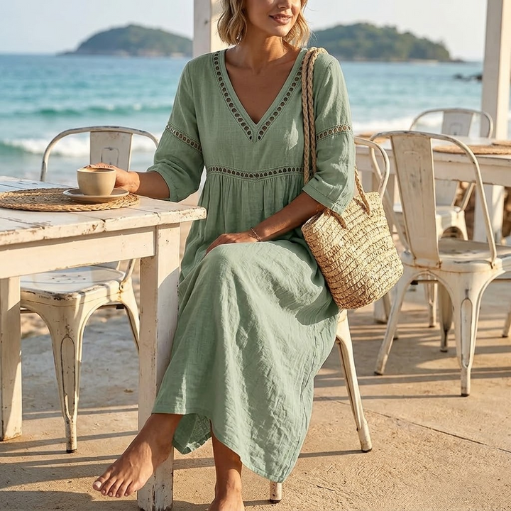 Elegant women's flowy midi dress featuring a stylish V-neck and delicate crochet detailing.