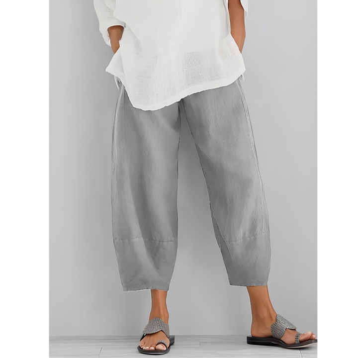 Stylish women's wide-leg linen pants featuring a comfortable elastic waist, ideal for everyday wear.