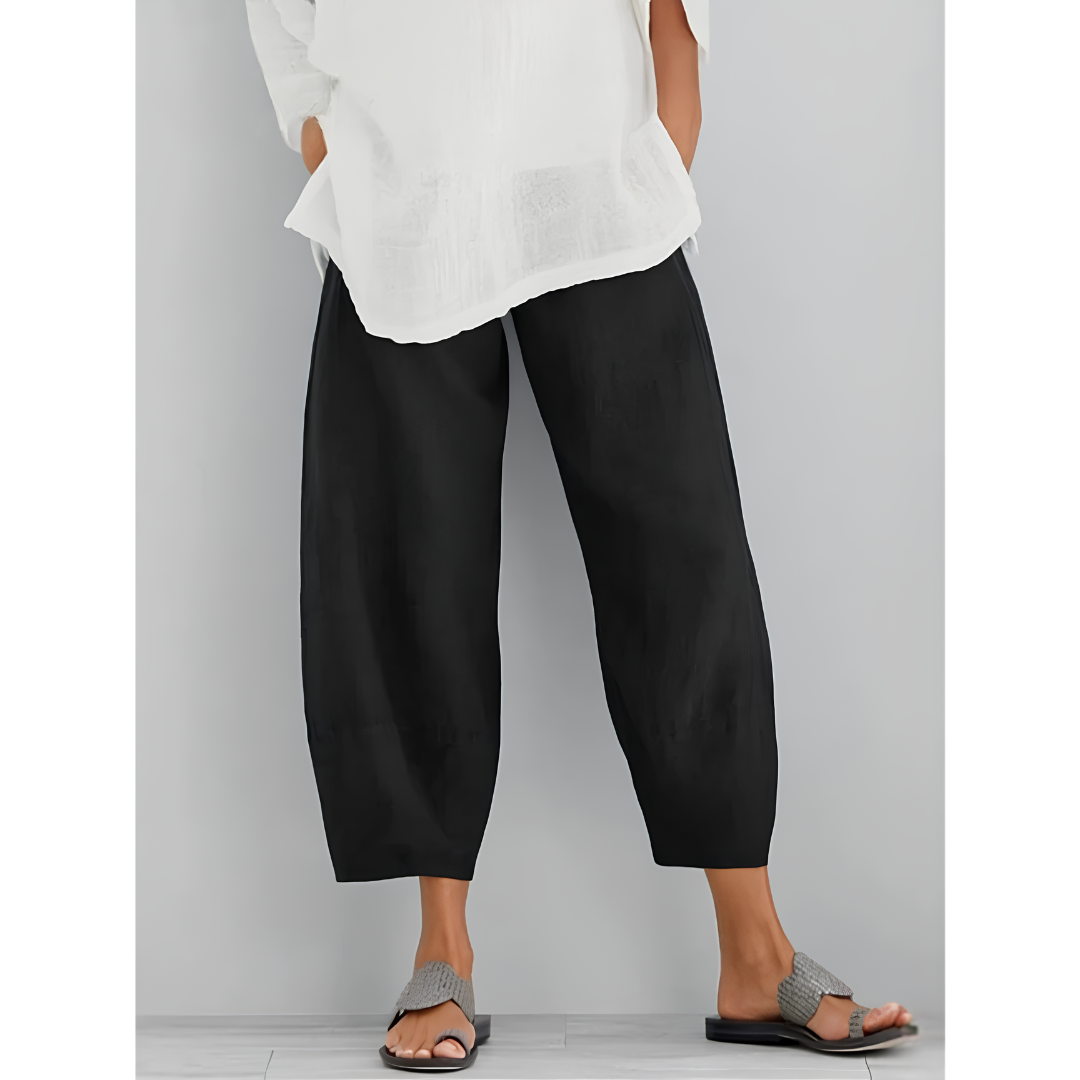 Comfortable women's cropped wide leg linen pants with an elastic waist, great for summer travel.