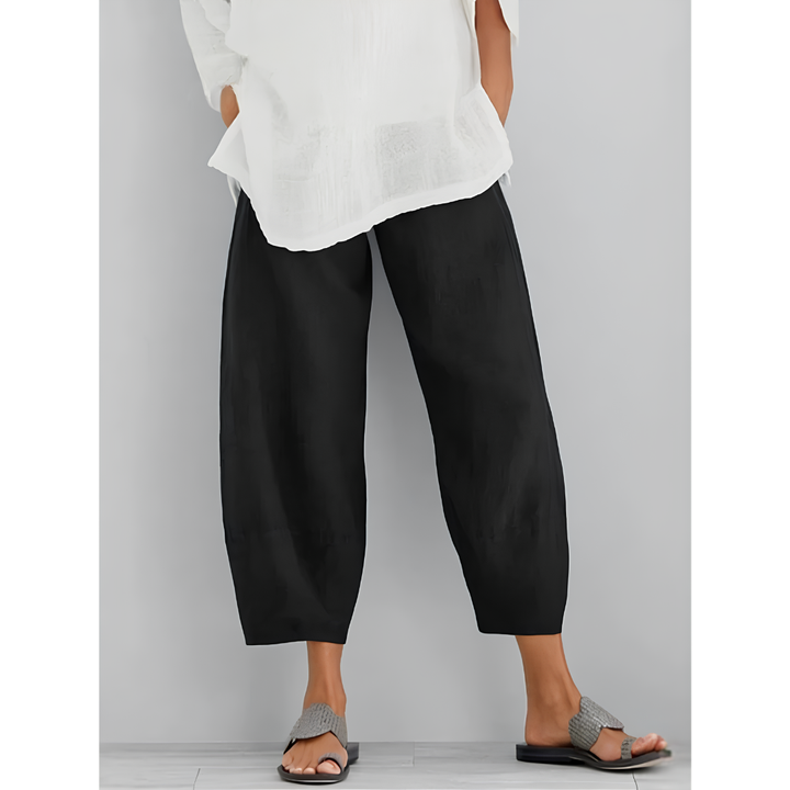 Comfortable women's cropped wide leg linen pants with an elastic waist, great for summer travel.