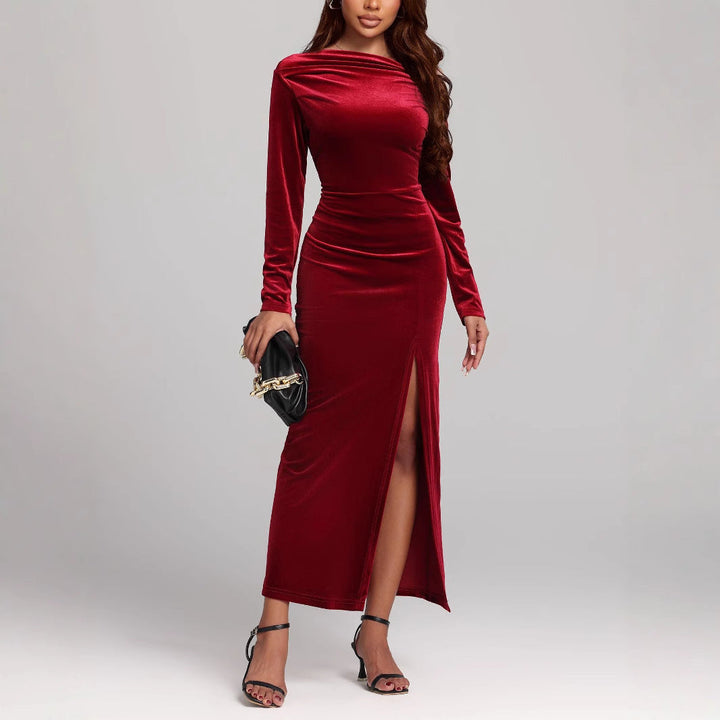 Women's red elegant long sleeve maxi dress with a boat neck, flattering ruched waist, and seductive side slit. Formal.