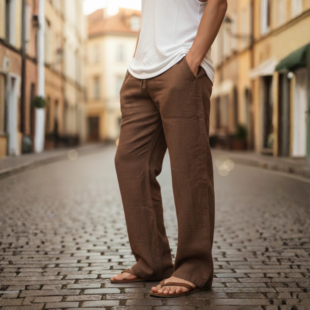 Man modeling comfortable men's relaxed wide leg drawstring pants, showcasing casual everyday fashion.