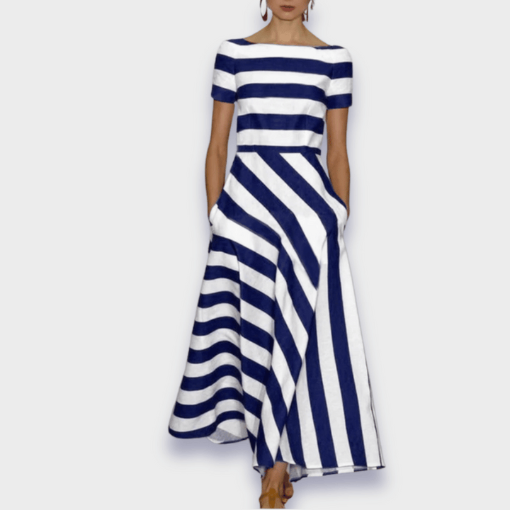 Chic black & white striped A-line midi dress for women. Elegant and comfortable, suitable for various occasions.
