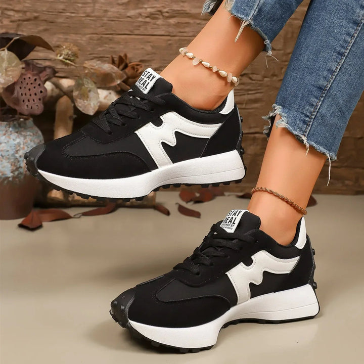 Premium women's striped platform shoes, combining a trendy design with supreme comfort for fashion-conscious wearers.
