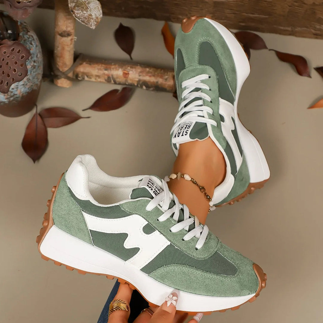Trendy women's fashion sneakers featuring a striped platform design, perfect for boosting everyday style & comfort.