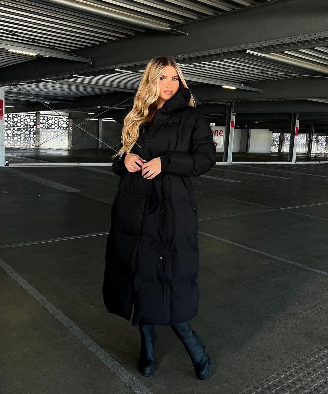 Warm beige women's long puffer jacket, ideal cozy outerwear for winter fashion and cold weather.